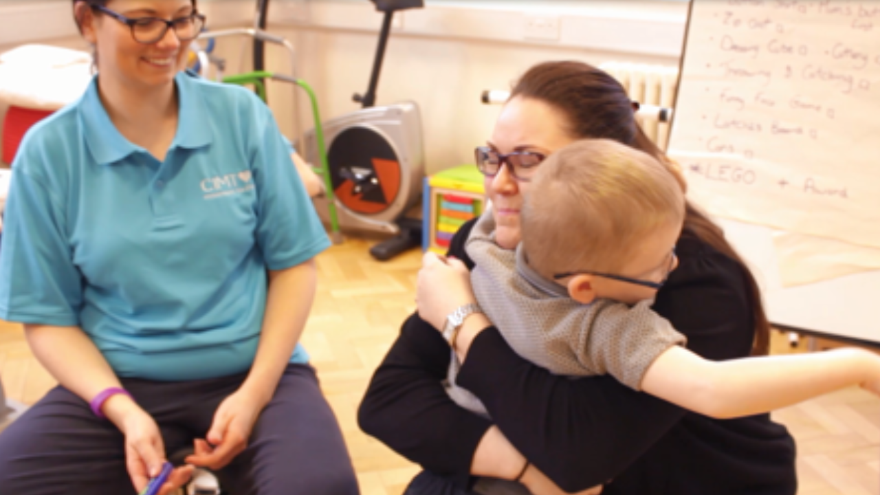 Harry hugging his mum during CIMT therapy.