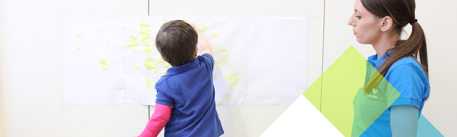 Child draws on paper during initial assessment