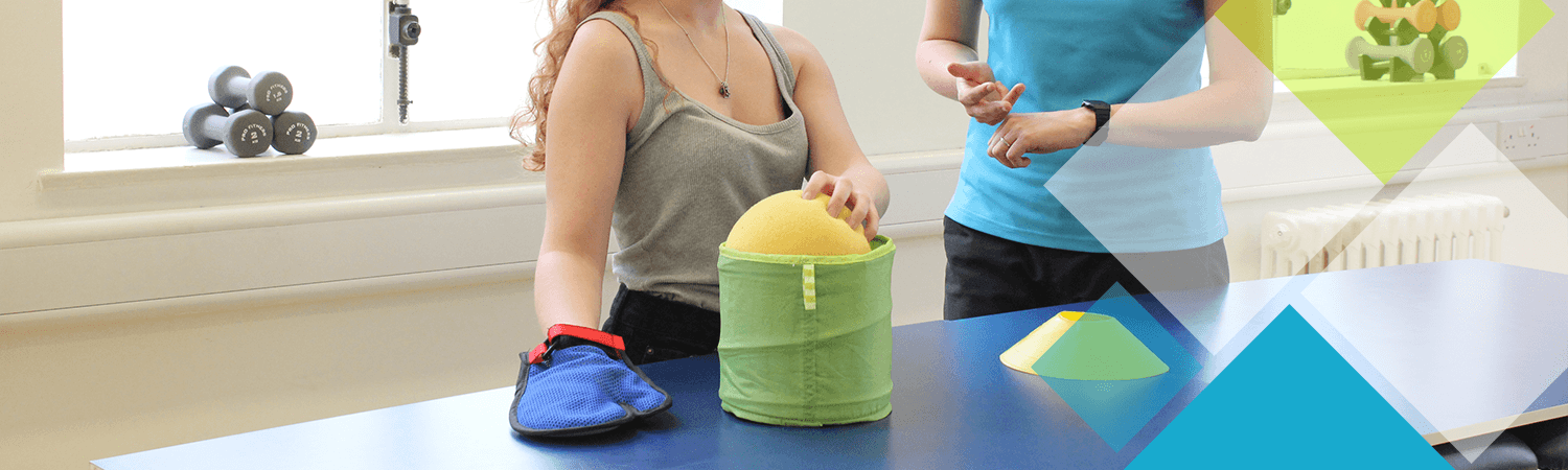 Patient with hand mitt tackles a CIMT activity