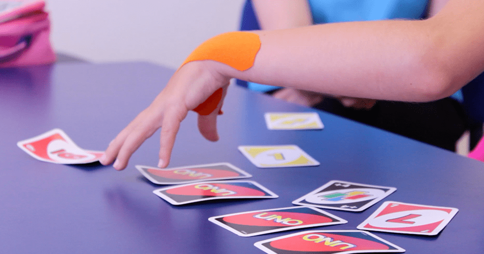 Uno the board game being used during therapy.